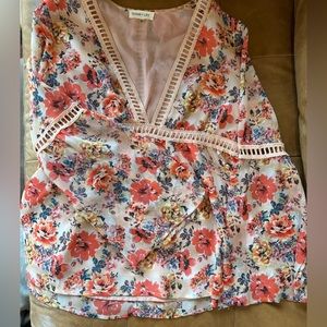 Floral 1970s inspired blouse with bell sleeves